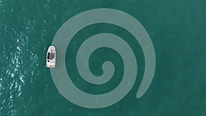 Motorboat Sailing In The Turquoise Sea - Aerial Shot During Daytime In Spain
