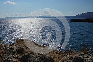 A motorboat sails on the Mediterranean Sea off the coast of Pefki in August. Rhodes Island, Greece