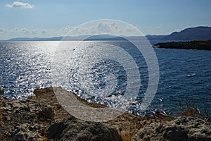 A motorboat sails on the Mediterranean Sea off the coast of Pefki in August. Rhodes Island, Greece