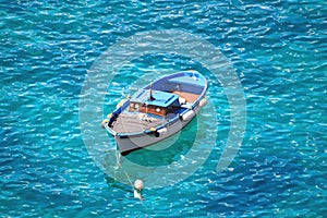 Motorboat swinging on water of Tyrrhenian sea, Ischia island - Italy