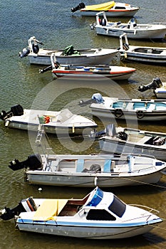 Motorboats Moored in River photo