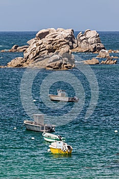 Motorboats and smacks on the Brittany seashore in France photo