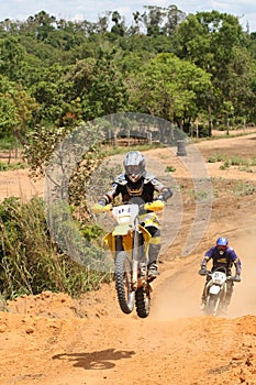 Motorcross Rider on Motorcycle In Race photo