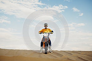 Motorcross rider with raised hand front view