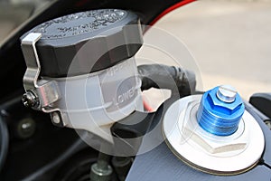 Motorcycle brake oil level and preload photo