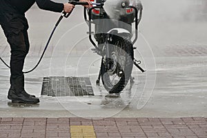 Motorcycle Car Wash Motorcycle Make more clean. A series of photos a biker washes his motorcycle at the car wash