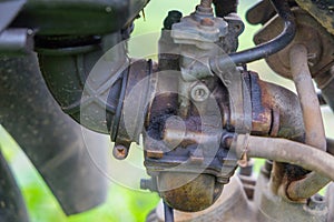 Motorcycle carburetor damaged and leaking photo