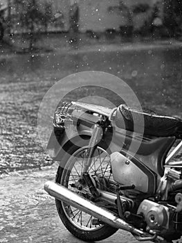 MOTORCYCLE AND CLOSE-UP OF RAINDROPS