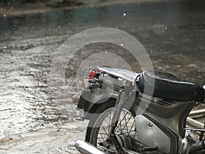 MOTORCYCLE AND CLOSE-UP OF RAINDROPS