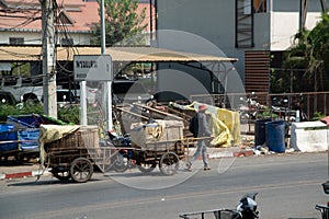 Worker drag the cargo wheels that bulk cargo at Thai-Cambodian border.