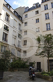 A motorcycle in a courtyard Le Marais Paris