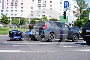 Motorcycle crashed into back of car on road closeup