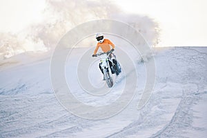 Motorcycle, desert dust and moto sport with athlete outdoor on hill with race, journey and adventure. Extreme, workout