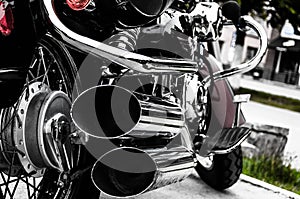 Motorcycle, double tailpipe. Rear view. Artistically discolored photo. Bikers. Motor style photo