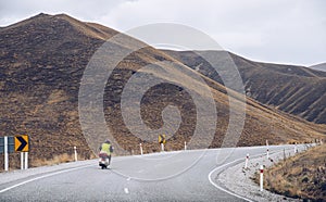 A motorcycle drive on the road of Lindis pass, New Zealand.
