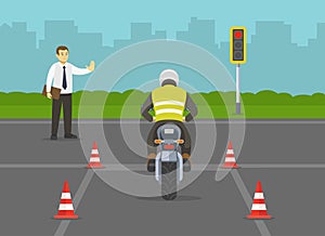 Motorcycle driving practice test with red cones. Llearner motorcyclist practising to ride a bike. Instructor makes a stop gesture.