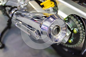 Motorcycle exhaust with the focus on the chrome exhaust