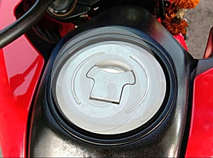 Motorcycle fuel oil tank cap on cement floor background closeup