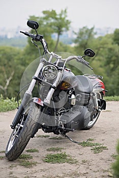 Motorcycle on a green background in summer front view