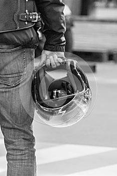 Motorcycle helmet in biker hand