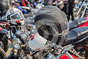 Motorcycle helmets on the handlebars of a motorcycle