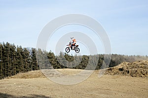 Motorcycle jump from springboard outdoor training, lifestyle people concept