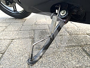 Motorcycle kickstand made of black metal