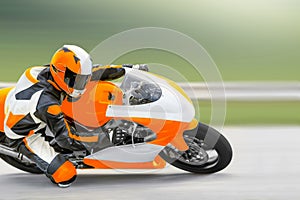 Motorcycle leaning into a fast corner on track