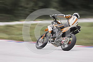 Motorcycle leaning into a fast corner on track