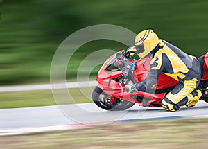 Motorcycle leaning into a fast corner on track