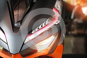 Motorcycle led headlight , broken headlight after the accident at motorcycle garage