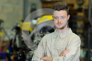 motorcycle mechanic looking at camera