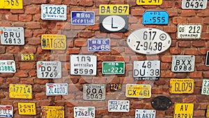 Motorcycle museum, Tiradentes, Brazil: side by side framed license plates