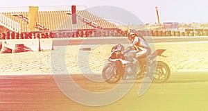 Motorcycle racer rides on a sports track