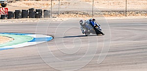 Motorcycle racer rides on a sports track