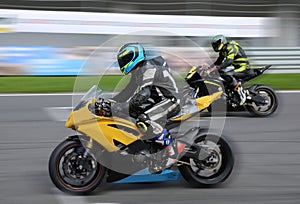 Motorcycle racers compete on the race track