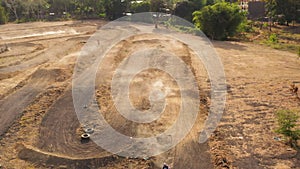 Motorcycle racers on the motocross track.