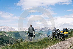 Motorcycle rider enjoy the momment. Touring adventure motorbike on the top of mountain, enduro, off road, beautiful view, danger photo