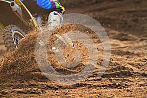 Motorcycle rider make huge dust splashed