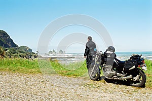 Motorcycle rider viewing ocean