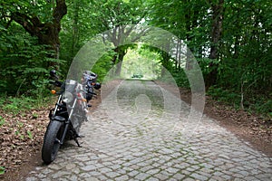 motorcycle on the roadside near the alley.