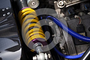 Motorcycle shock absorber with metallic springs