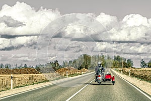 Motorcycle with sidecar on country roads