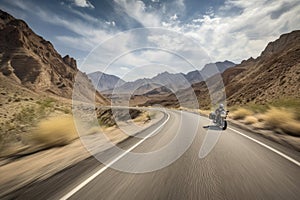 motorcycle speeding past scenic mountain range