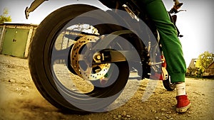 Motorcycle spinning wheel, close up slow motion