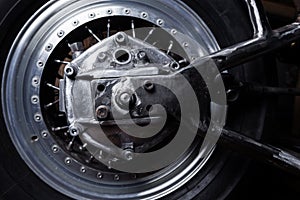 Motorcycle swingarm and wheel close-up