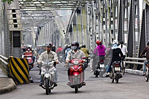 Motorcycle Traffic on a Steel bridge in Vietnam