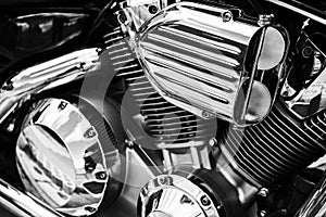 Motorcycle V-configuration engine with shiny chrome parts close up detail. V-twin motorbike chromium engine. Motorcycle V-type