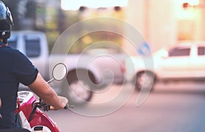 Motorcycle waiting for green light to go to work on crossroad with safty helmet in business success glory concept