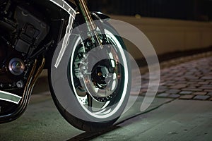 motorcycle wheel with reflective rim tape for night visibility